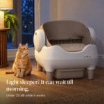 cleannest-open-top-self-cleaning-litter-box-quiet-at-night Orange tabby beside the CleanNest litter box at dusk. Text: Light sleeper? It can wait till morning. Under 20 dB.